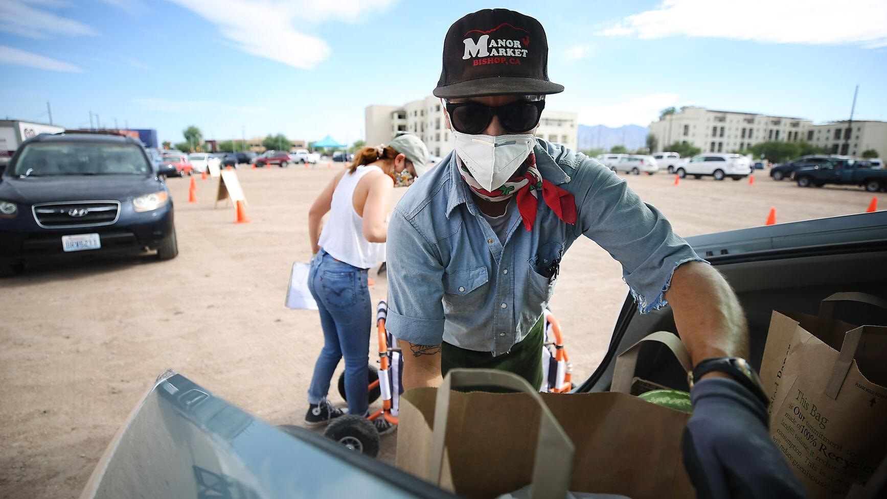Photos: Community Food Bank hosts Drive-up Farmer's Market